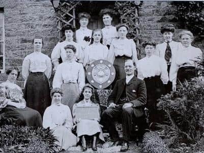 Mr James Smith, headmaster of Pooleys Endowed School with the Wray Girls Friendly Society outside the school house in 1907. The girls are the winners of the Southport Musical Festival shield. Picture courtesy of David Kenyon.
