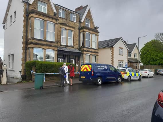 A property on Balmoral Road in Morecambe is cordoned off with police tape and there are crime scene investigators at the scene.