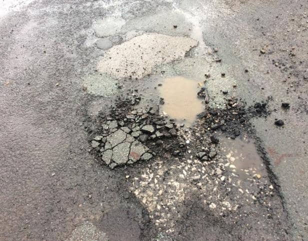 A section of crumbling carriageway on Daffodil Close in Helmshore (image: Dave Carter)