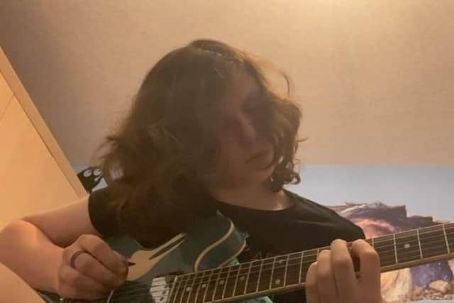 Callum, now 14, is a keen guitarist.