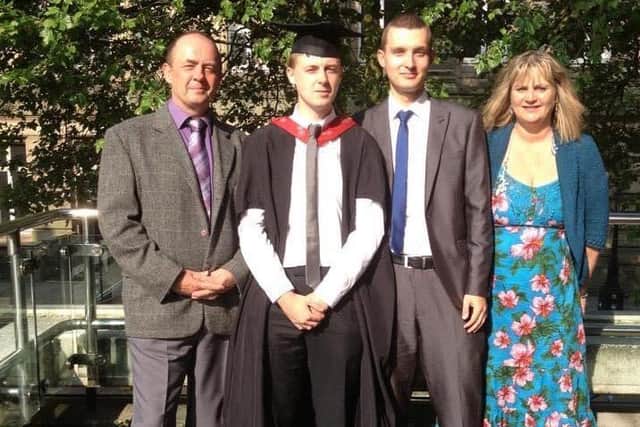 Michael pictured at brother David's graduation with their parents Joand Chris - this was the last photo taken of the family together.
