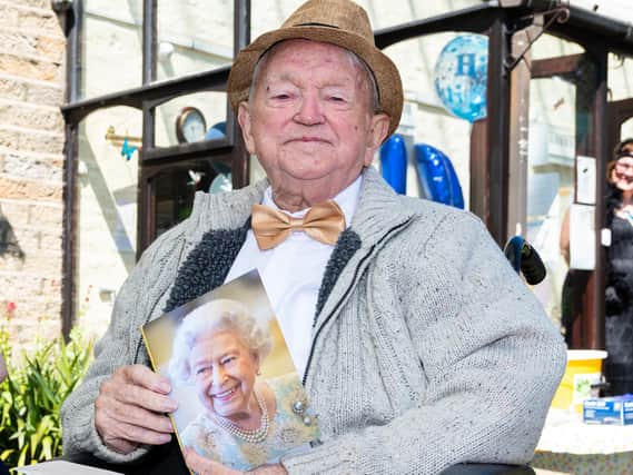 Tom Hanley with his birthday card from the Queen.