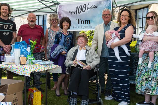 Tom Hanley celebrates his 100th birthday with his family.
