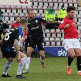 Jay Spearing (challenging Cole Stockton) has had his say on Morecambe's play-off semi-final with Tranmere Rovers