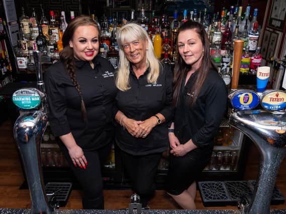 Caitlin Povey, Teresa Winward, and Rayanne Stockton working at The Lord Nelson.