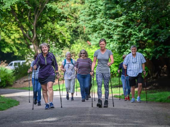 A group of U3A members take part in a Nordic walking event.