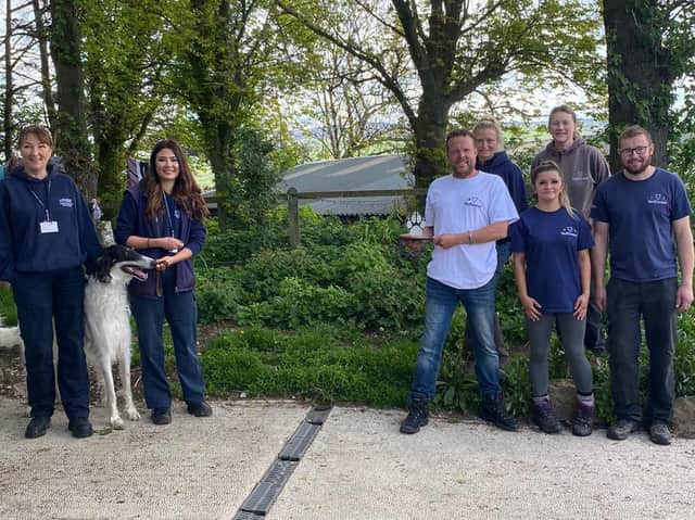 Sarah Hayland and Sarah Jones from Lancaster City Council's dog warden and animal licensing team presenting the award (socially distanced) to the team from Wolfwood Wildlife and Dog Rescue.