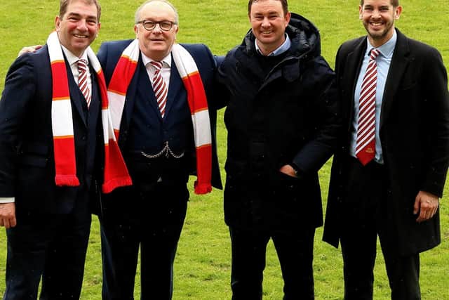 Morecambe's board and manager celebrate reaching Wembley last weekend