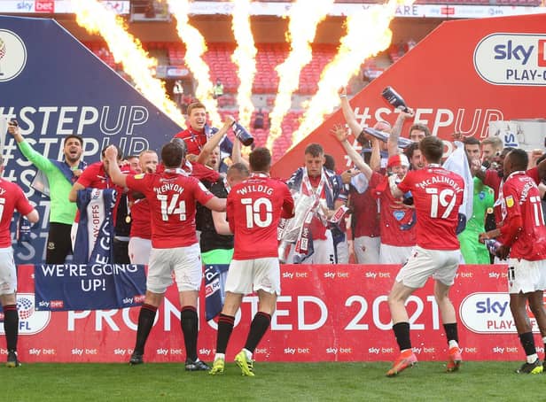 Morecambe players celebrate at Wembley (Photo: Rob Newell/CameraSport)