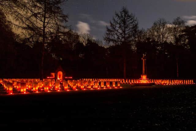 Candles on the graves at the Overloon Cemetery in the Netherlands. Picture by albert-hendriks.