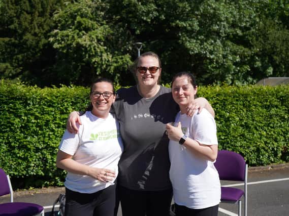 Celebrating the end of their walk are, from left, Jen, Luise and Nicola.