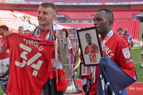 Sam Lavelle and Carlos Mendes Gomes pay tribute to Christian Mbulu after victory at Wembley
