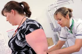 Samantha Musson, team leader in the Women's Health and Continence Physiotherapy, works with Tori Draper.