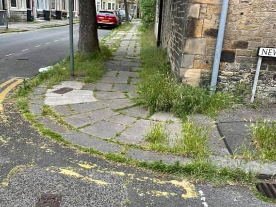 County Coun Charlie Edwards is calling on residents to help clear the streets of weeds.