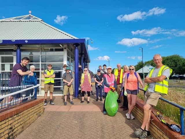 Coun Charlie Edwards (left) with other councillors and volunteers during the Morecambe tidy-up on Friday.