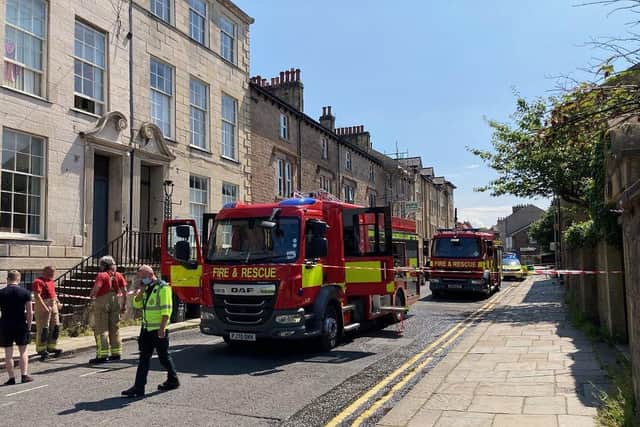 Firefighters and paramedics at the scene in Queen Street. (Photo by Joshua Brandwood)