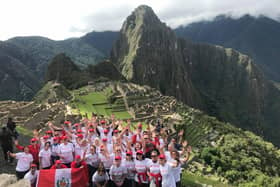 The Peru trekkers arrive at Machu Picchu in 2018. Debbie is front row, fourth from right.