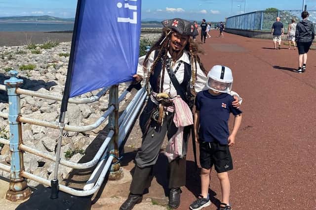 Henry with Captain Jack Sparrow during his bike ride in Morecambe. Photo credit: Keith Sargeant