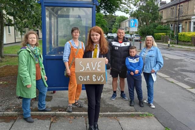 Concerned parents, pupils and councillors gather to protest againt the bus service cut