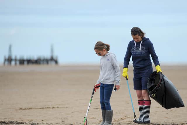 Litter pickers on St Annes beach.  Dawn Chapman with daughter Sophia Mason, 9.