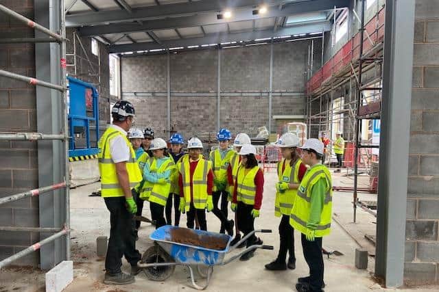 Bowerham Primary School pupils laying the final bricks of the Energy Centre.