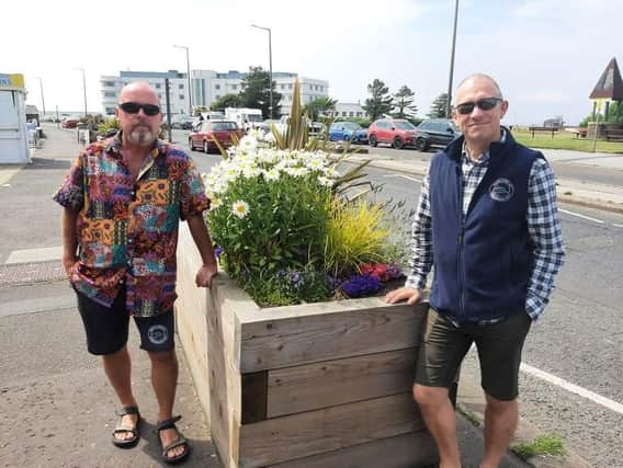 John O'Neill, Morecambe BID manager, and Tom Powney, Morecambe BID chairman, with one of the planters which has been funded by the BID.