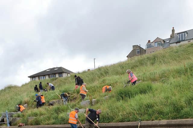 Volunteers from local community groups turned up to do weeding at Sunny Slopes in Heysham, said Lancaster City Council.