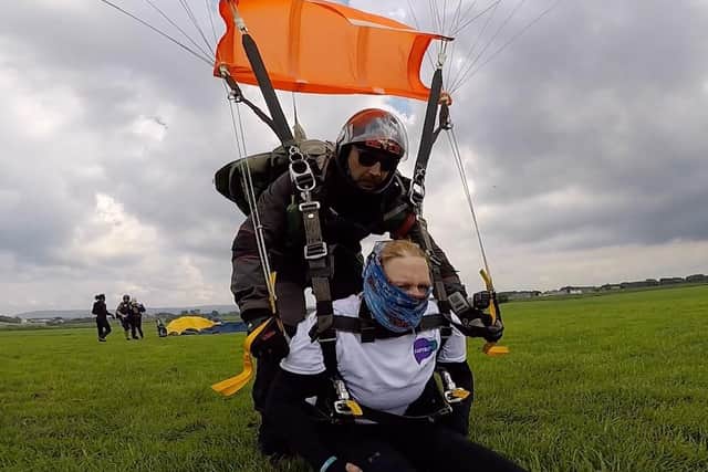 Jo Towers pictured landing from her tandem skydive at Black Knights Parachute Centre.