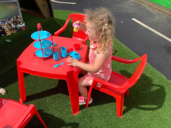 Youngsters enjoy the play area at Cawthorne's Endowed Primary School.