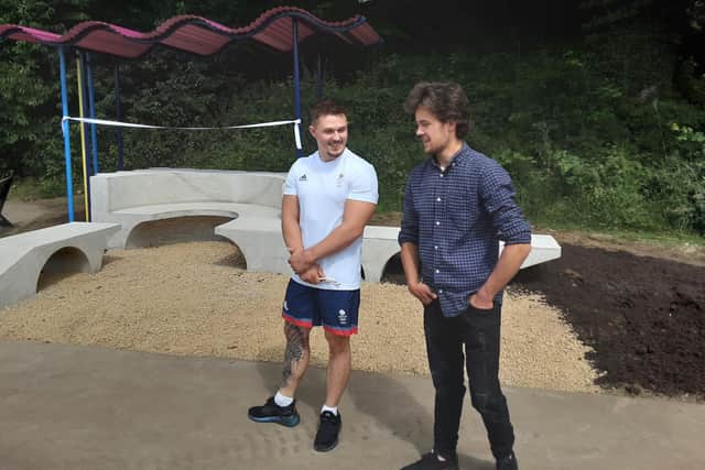 Billy Walden with Olympic gymnast Brinn Bevan at the finished seating area.