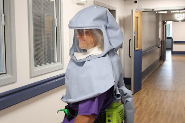 Matron Sally Young from UHMBT models one of the hoods.