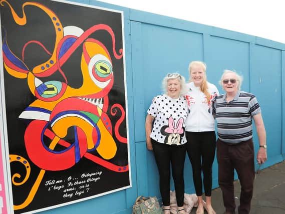 Polly Swann with her grandmother Barbara McInnes and organiser Bob Pickersgill at the unveiling of Barbara's octopus artowrk on Morecambe prom. Photo by Mike Jackson
