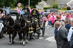 Mourners line the streets as the horse-drawn carriage makes its way on Frank's final journey.