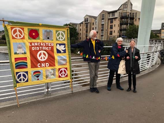 Lancaster campaigners mark the Nagasaki atomic bomb anniversary with Millennium Bridge event.
