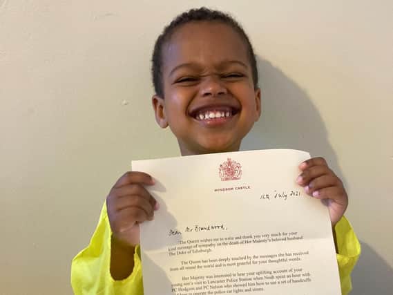 Proud Noah with his letter from the Queen.
