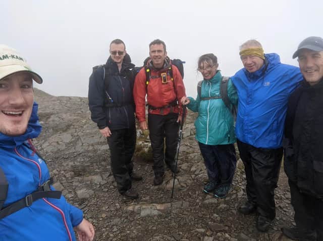 The team at the top of a peak.