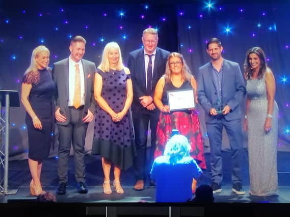 Delegates from Lancaster City Council receiving the award for ‘Best service team – housing, construction and building service’ from the host of the awards, Sameena Ali-Khan.