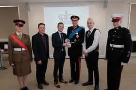 The Beyond Radio team receive the award from Her Majesty's Lord-Lieutenant of Lancashire, The Rt Hon the Lord Shuttleworth. Beyond Radio team from left: Nathan Hill (commercial director), Steven Normyle (managing director) and Luke Edmondson (station volunteer).