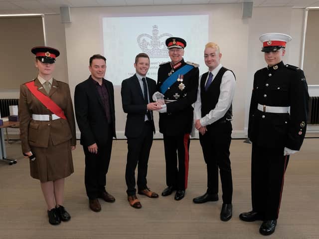 The Beyond Radio team receive the award from Her Majesty's Lord-Lieutenant of Lancashire, The Rt Hon the Lord Shuttleworth. Beyond Radio team from left: Nathan Hill (commercial director), Steven Normyle (managing director) and Luke Edmondson (station volunteer).