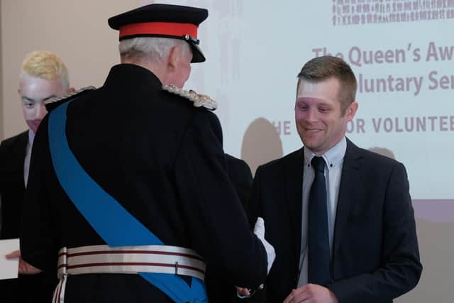 The Rt Hon the Lord Shuttleworth, Her Majesty's Lord-Lieutenant of Lancashire, congratulates Beyond Radio managing director Steven Normyle on the station's award.
