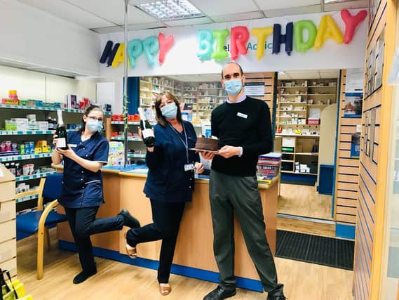 Staff Jan, Jenny and co-owner and pharmacist Ben Fell celebrate Carnforth Pharmacy's first birthday.