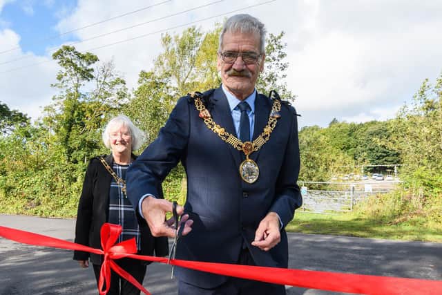 The Mayor and Mayoress of Lancaster, Mike and Margaret Greenall, cut the ribbon for the official opening of the Lancaster flood defences scheme.