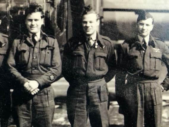 Gordon Stobbart (centre) with crew mates.