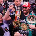 Referee Russell Mora holds up the arm of Tyson Fury as he celebrates his 11th-round knockout of Deontay Wilder to retain his WBC heavyweight title at T-Mobile Arena on October 9, 2021 in Las Vegas, Nevada.
