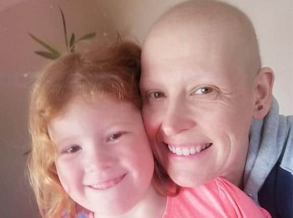 Jane Huddleston with her daughter Charlotte after losing her hair.