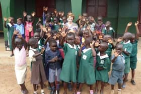 Carolyn with some of the Sudanese children during one of her visits to the school.