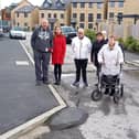 Fed-up residents on St George's Quay are unhappy with the uneven state of the roads