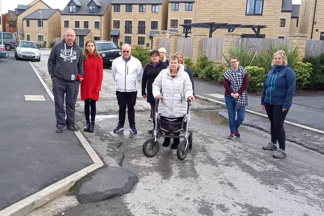Fed-up residents on St George's Quay are unhappy with the uneven state of the roads