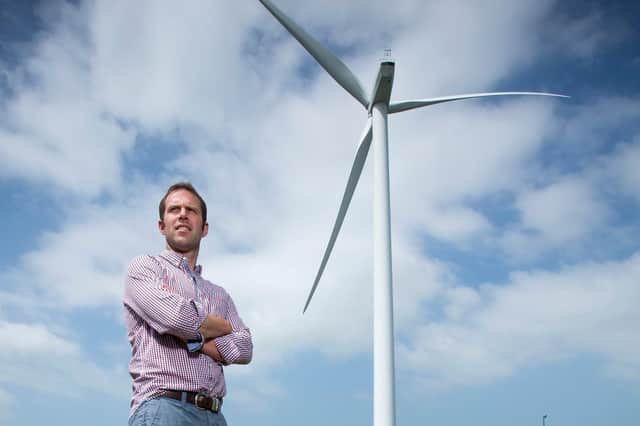 Nick Kenyon photographed by the landmark wind turbine at Dewlay