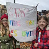 Isla Bradbury and Esme Donald both pupils of St Wilfrid's Primary in Halton with their banner as they took part in Greta's march in Glasgow during COP26.